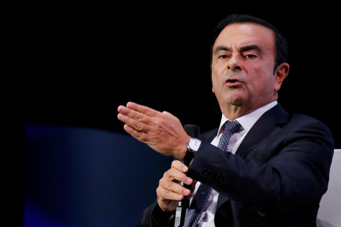 Carlos Ghosn, chairman and CEO of the Renault-Nissan-Mitsubishi Alliance, speaks at the Tomorrow In Motion event on the eve of press day at the Paris Auto Show, in Paris